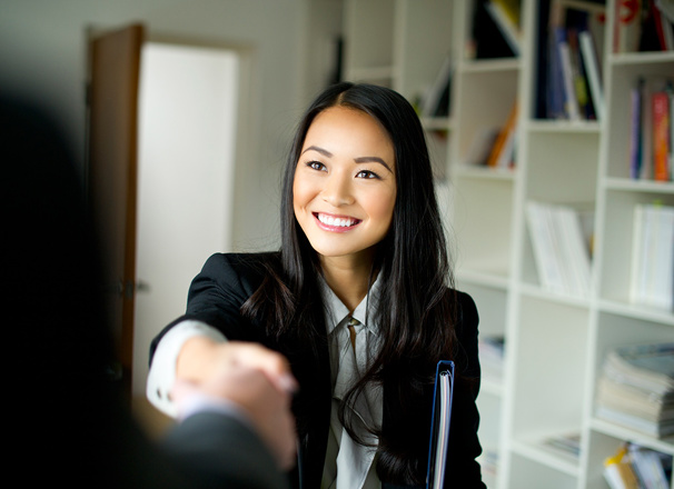 Person in business attire shaking hands