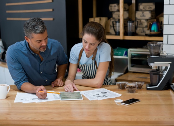 Small business owners going over finances