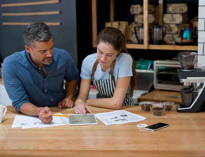 Small business owners going over finances