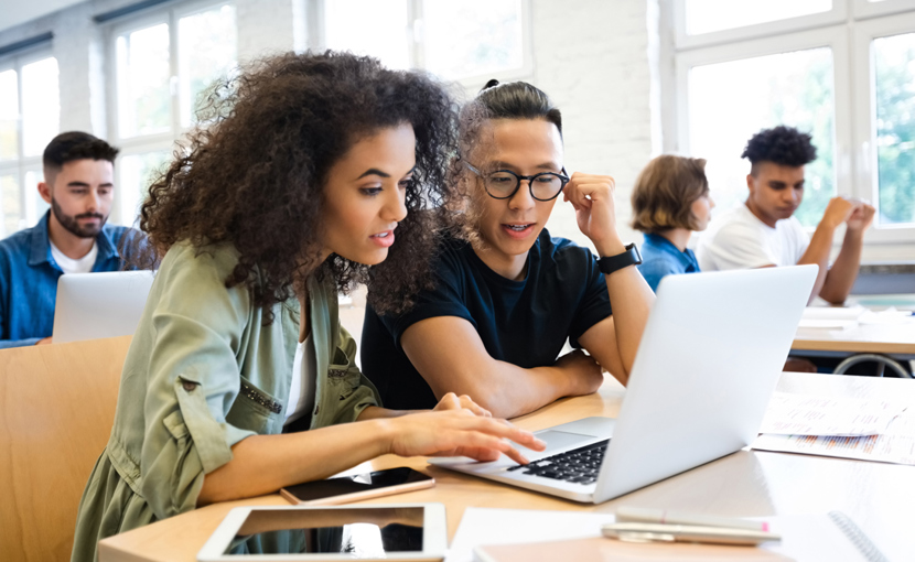 Classmates are learning through laptop