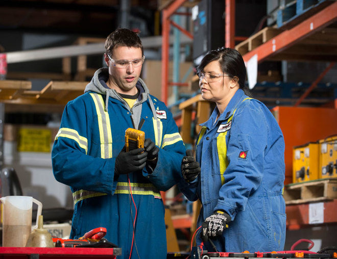 Warehouse staff looking at tools