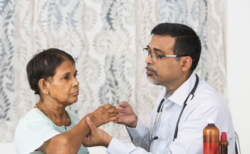 naturopathic doctor assessing patient