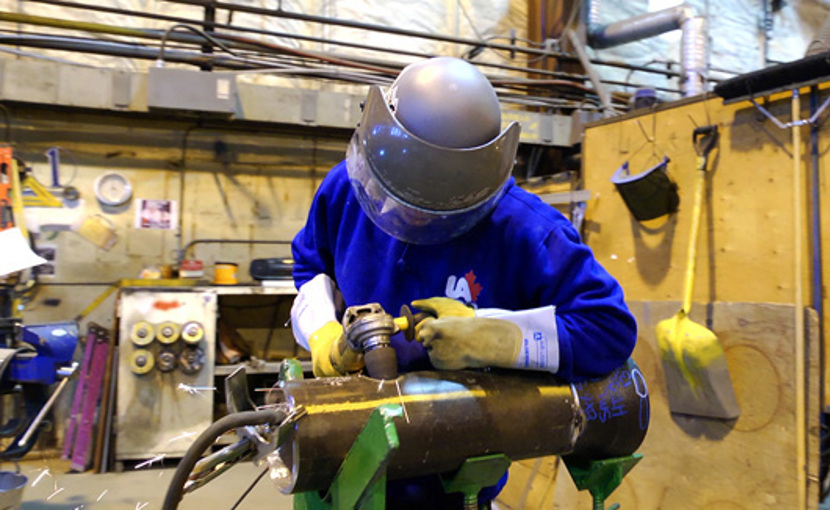 Steamfitter/pipefitter working in a shop
