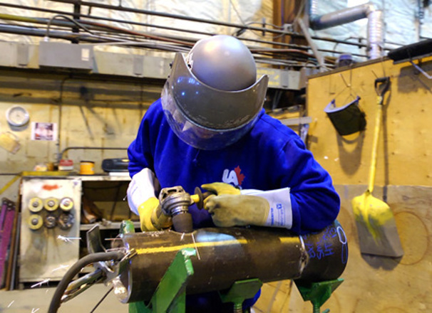 Steamfitter/pipefitter working in a shop