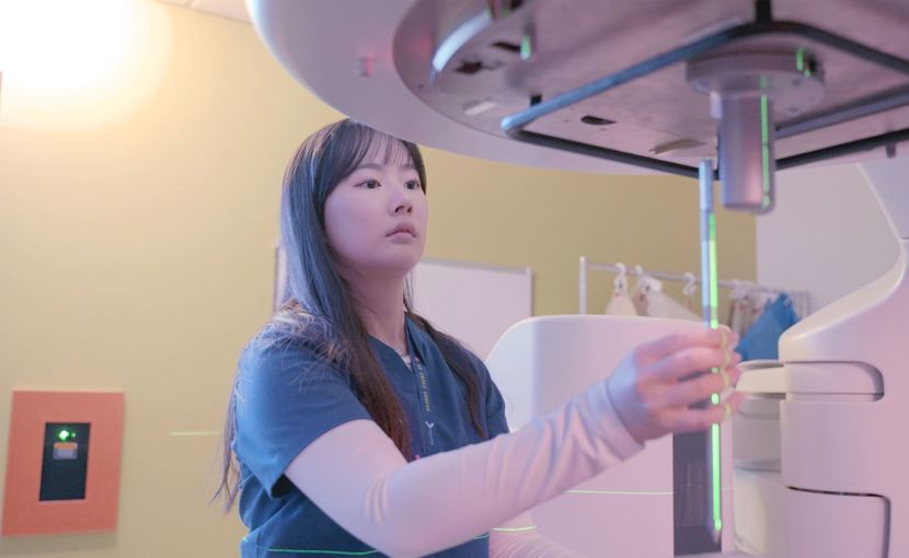 radiation therapist checking equipment