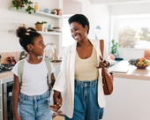 Mother and daughter leaving the house together in the morning. 