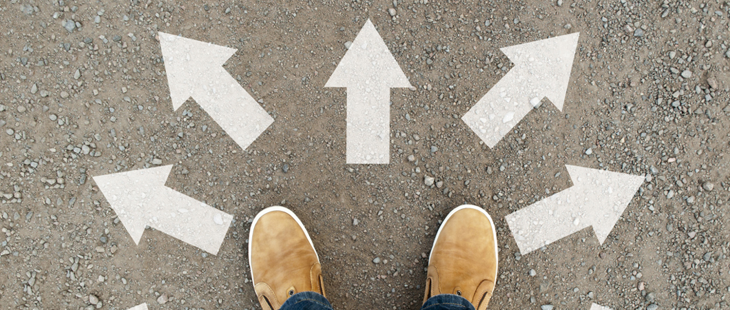 Feet amid arrows pointing in different directions