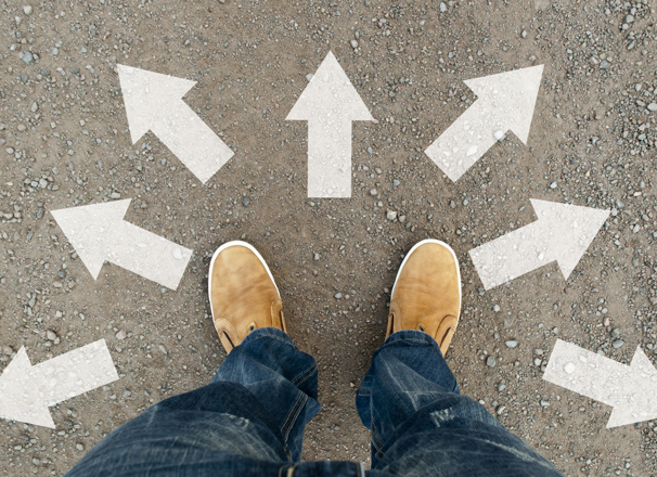 Feet amid arrows pointing in different directions