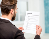 Person looking at a resumé 