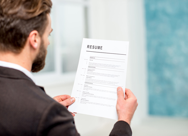 Person looking at a resumé 