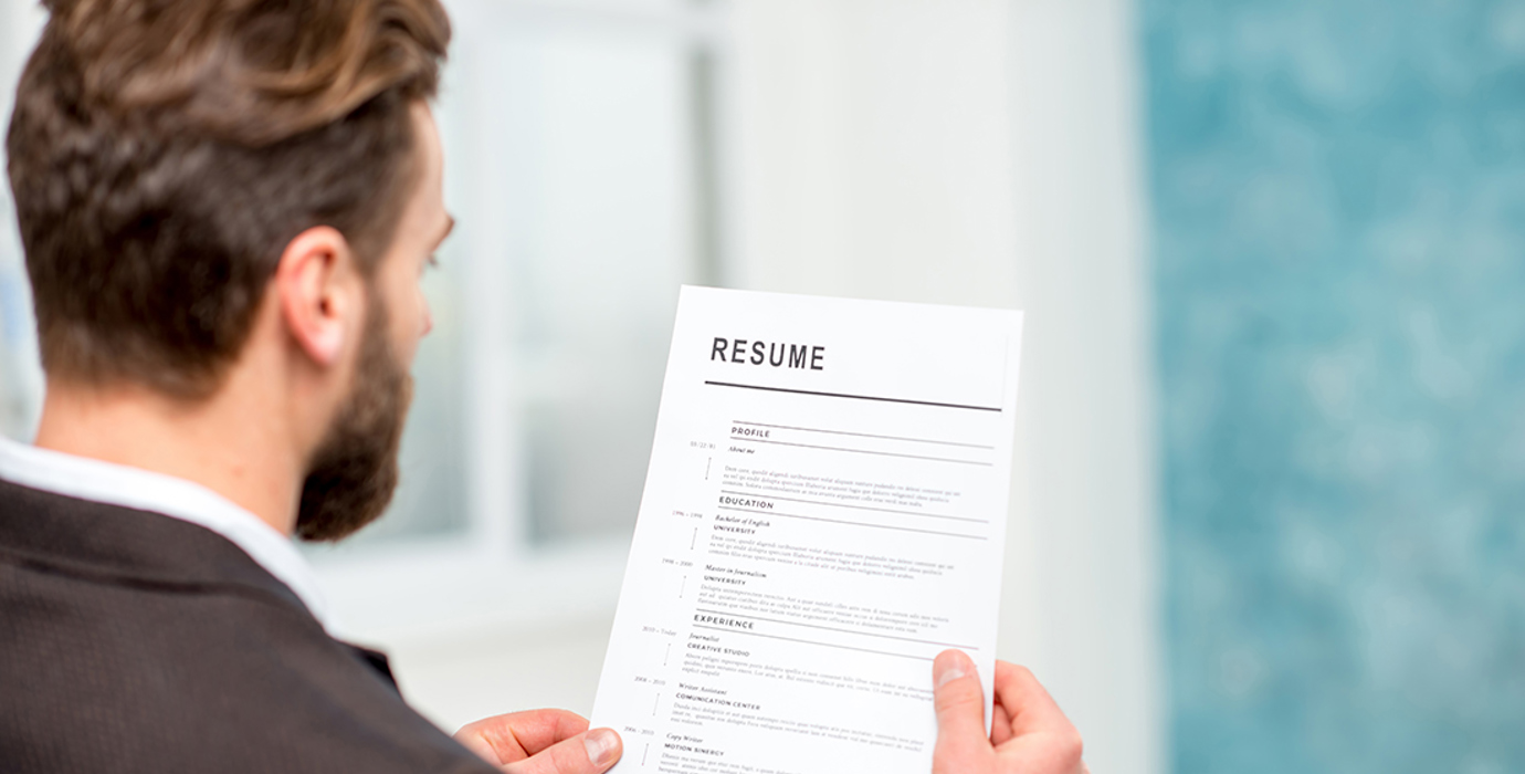 Person looking at a resumé 
