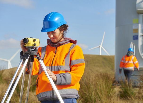 Person using technical instruments outside