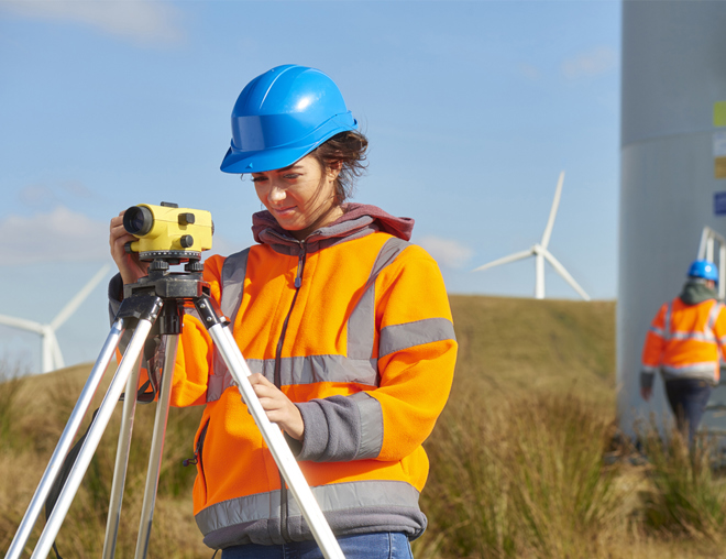 Person using technical instruments outside