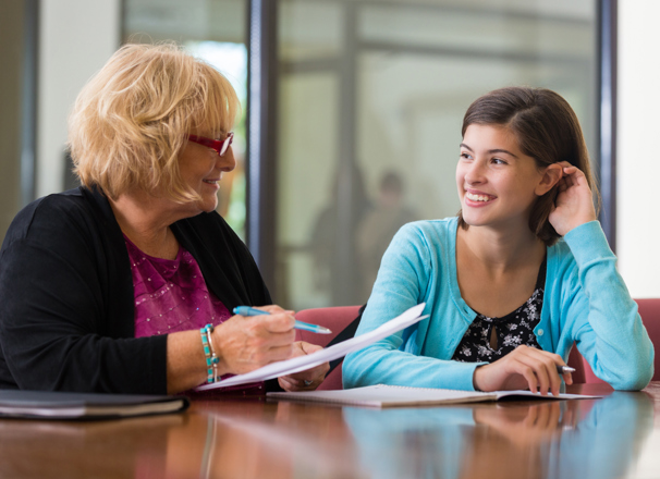 Youth talking to an adult in an office