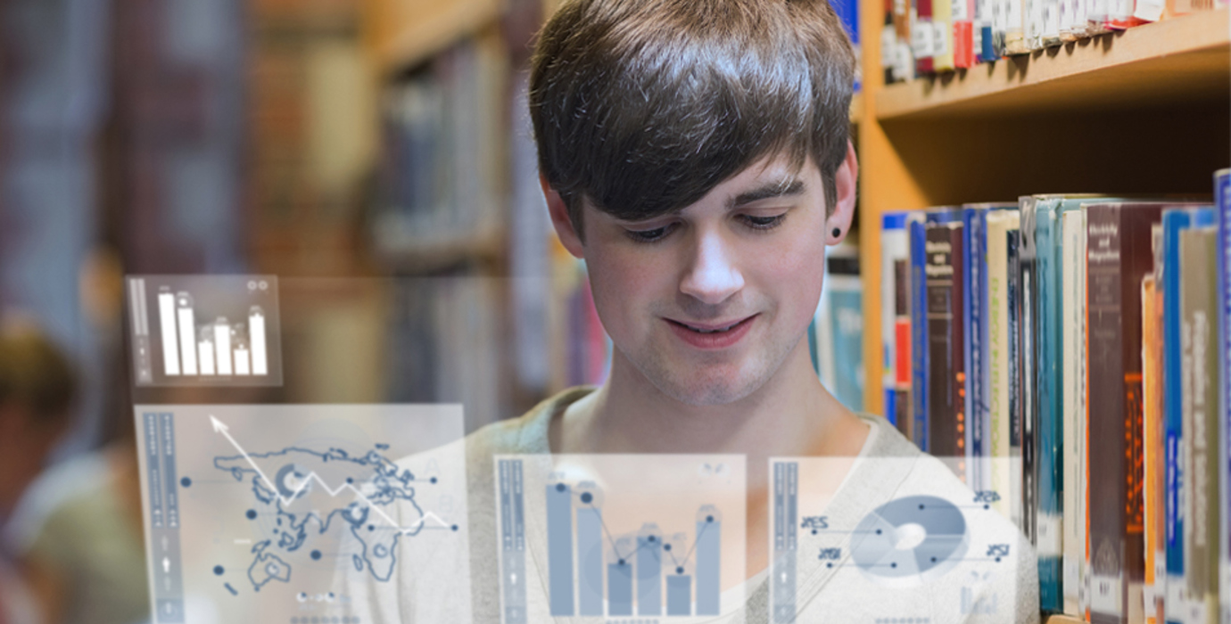 Student looking at a table with graphic overlay of graphs coming out from the tablet