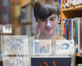 Student looking at a table with graphic overlay of graphs coming out from the tablet