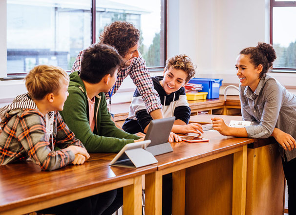 Teacher having a discussion with students in a classroom