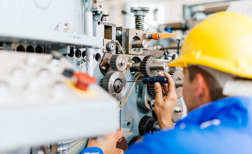 Millwright fixing a machine
