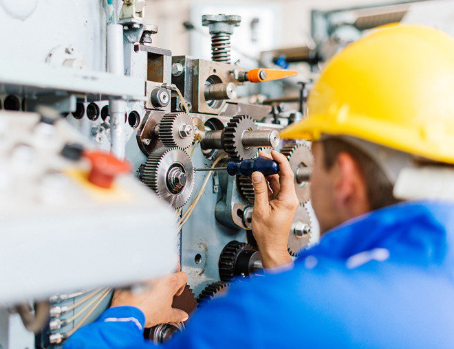 Millwright fixing a machine