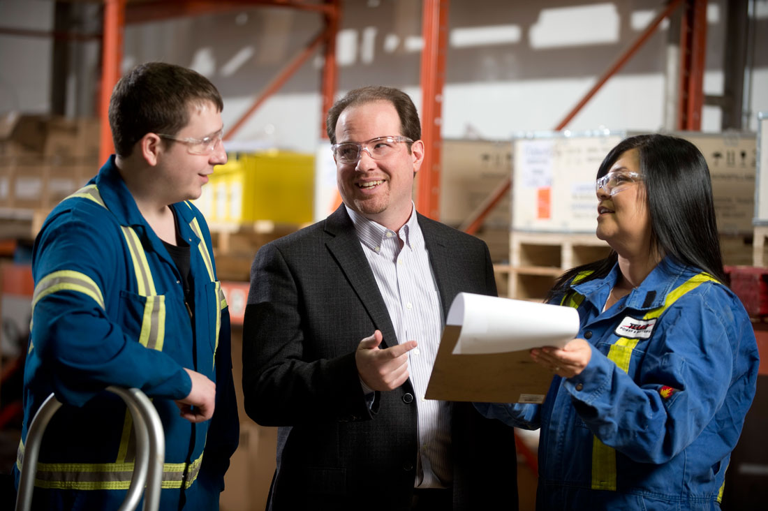Staff having a discussion in a warehouse