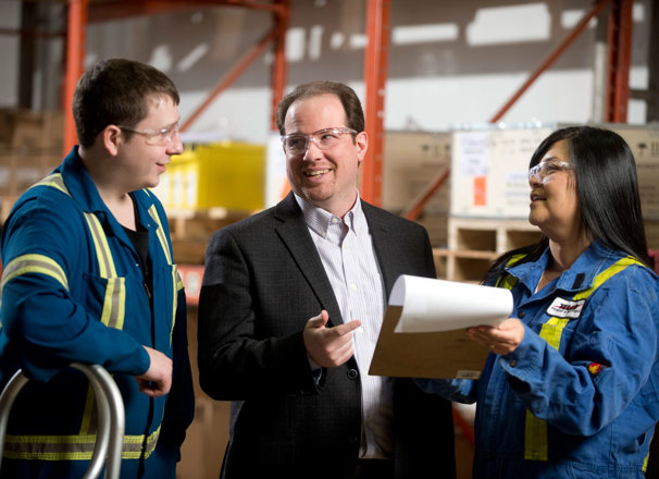 Staff having a discussion in a warehouse