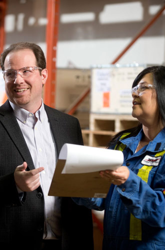 Staff having a discussion in a warehouse