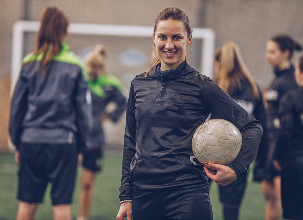 Soccer player holding a ball