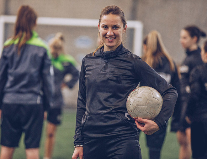 Soccer player holding a ball