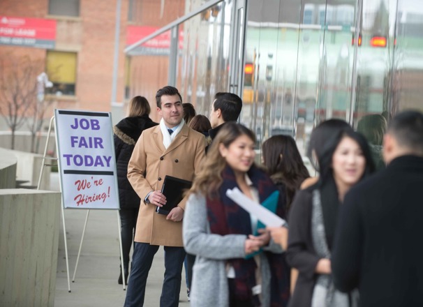 Job seekers standing in line at a job fair