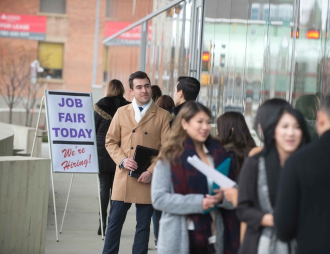 Job seekers standing in line at a job fair