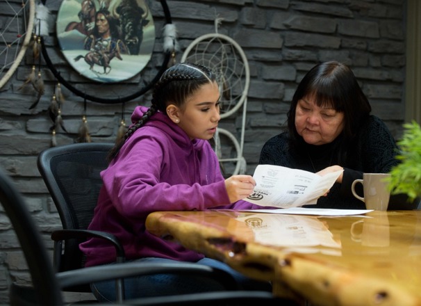 Student and Elder discussing career options looking at paperwork