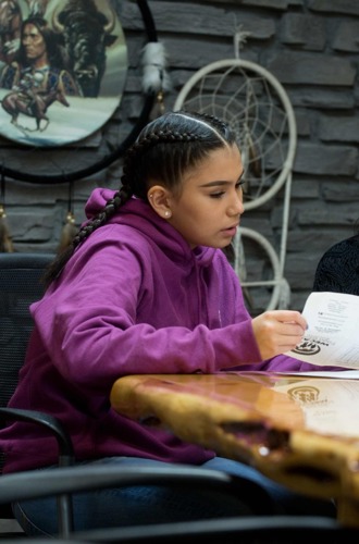 Student and Elder discussing career options looking at paperwork