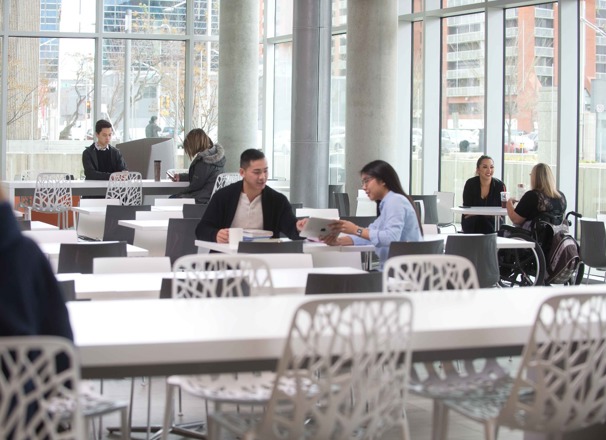 Students sitting in a large common study area