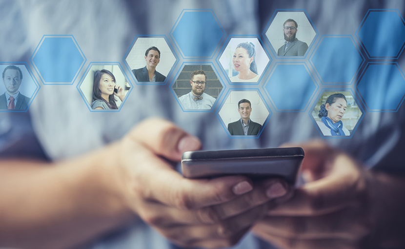 Hands holding a smartphone with profile photos of their network coming out of the phone