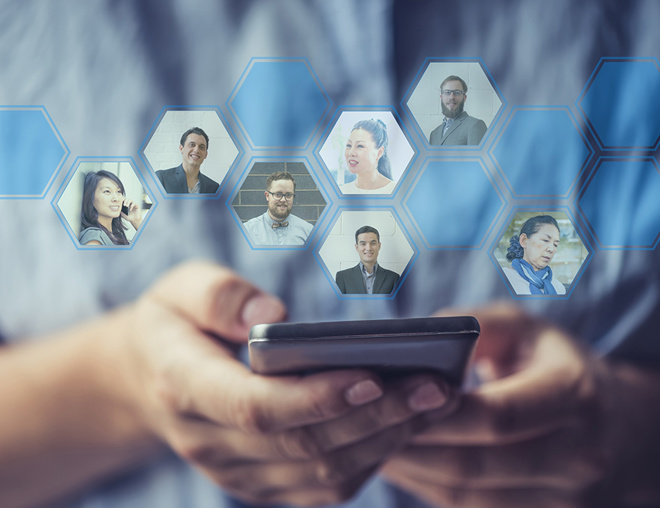 Hands holding a smartphone with profile photos of their network coming out of the phone