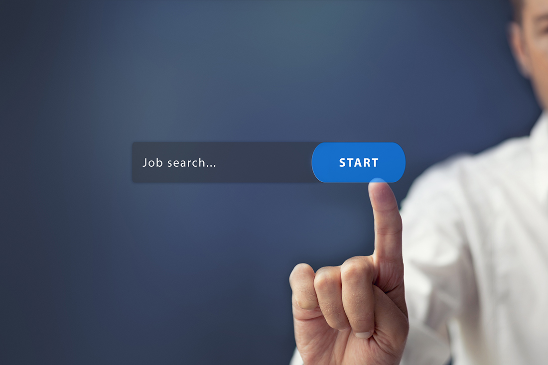 Finger pressing a "start" button on job search