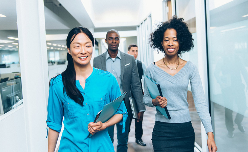 Office workers walking down a hallway