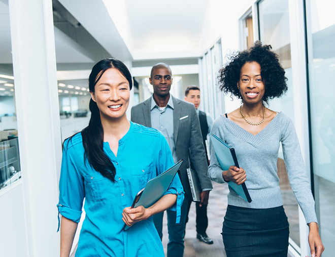Office workers walking down a hallway