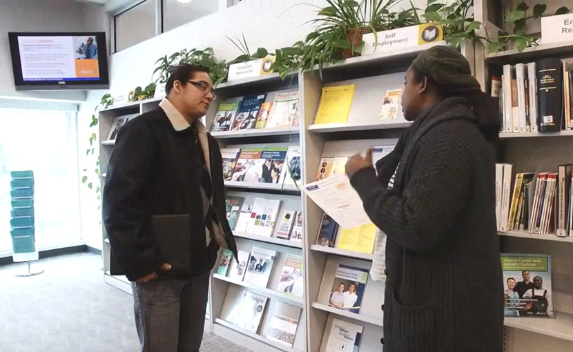 Job seeker discussing with career counsellor at an Alberta Supports Centre