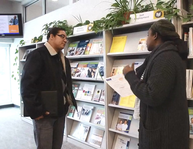 Job seeker discussing with career counsellor at an Alberta Supports Centre