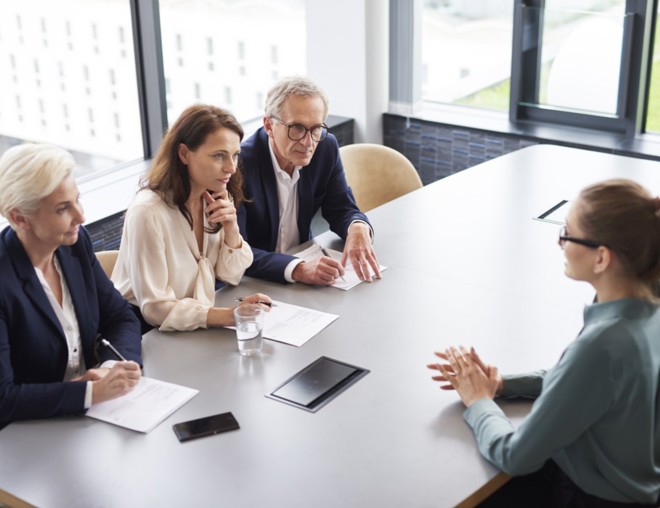 Interviewee during a job interview with a panel of 3 interviewers
