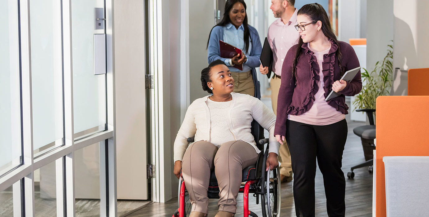 People going through a hallway to a meeting