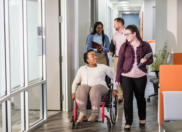 People going through a hallway to a meeting
