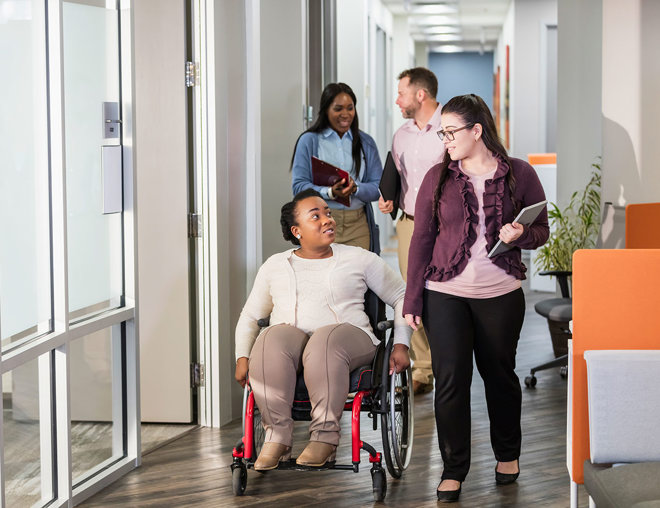 People going through a hallway to a meeting