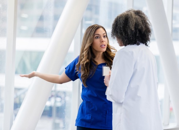 Two female health care workers having a disagreement.
