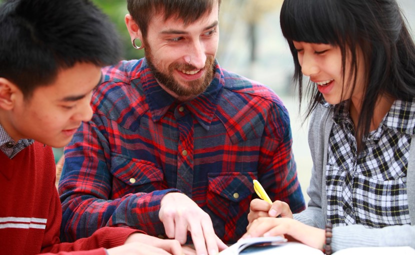 Three students learning English in a study group.