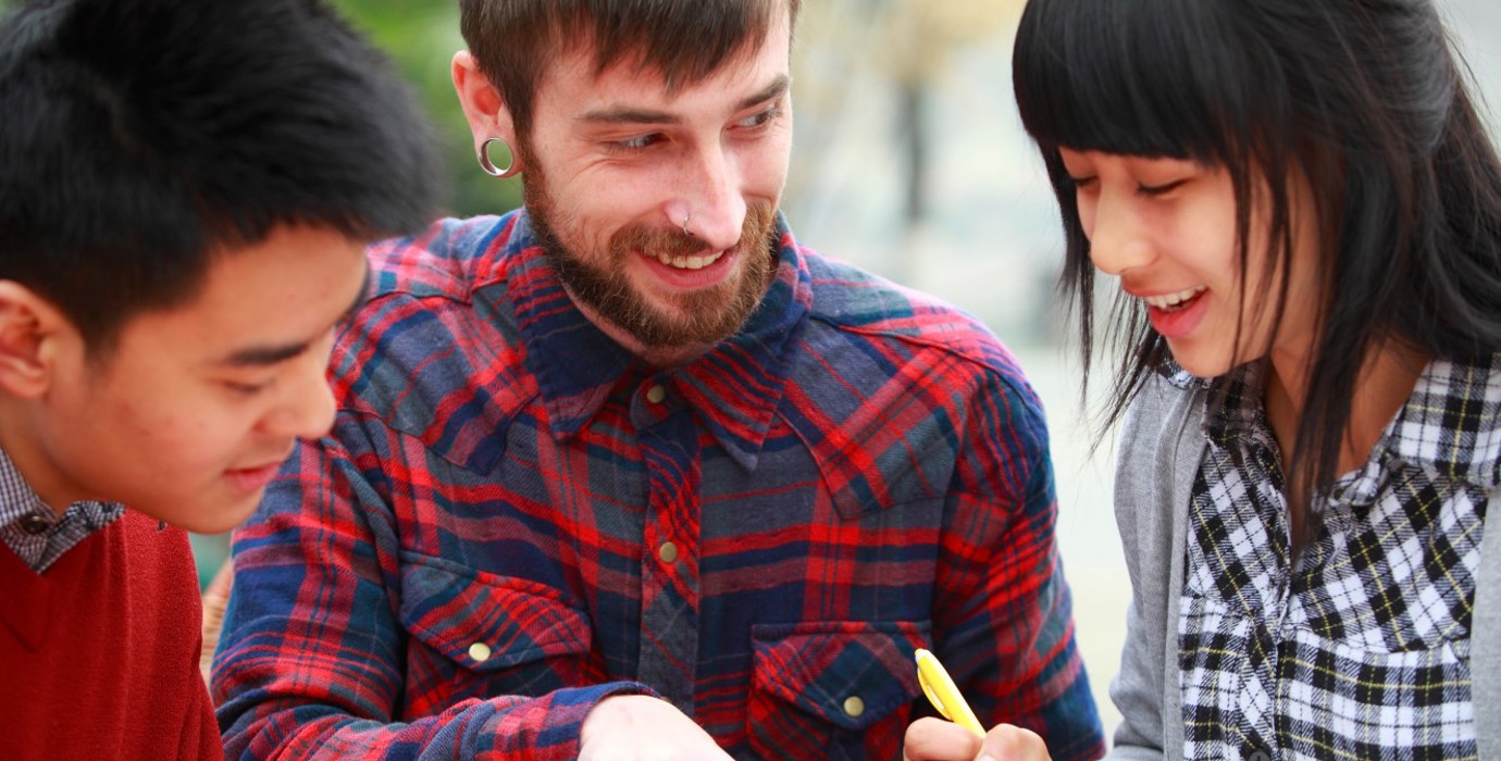 Three students learning English in a study group.