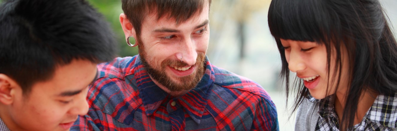 Three students learning English in a study group.