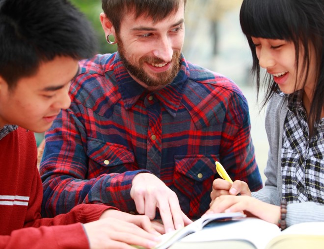 Three students learning English in a study group.