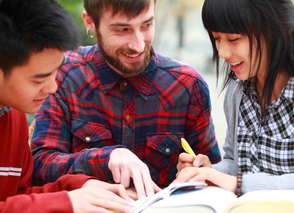 Three students learning English in a study group.